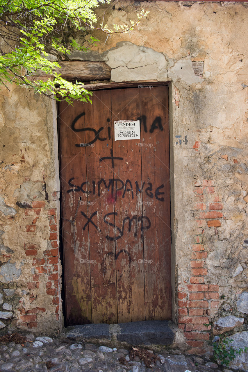 Old door in the city of Cefalu on Sicily.