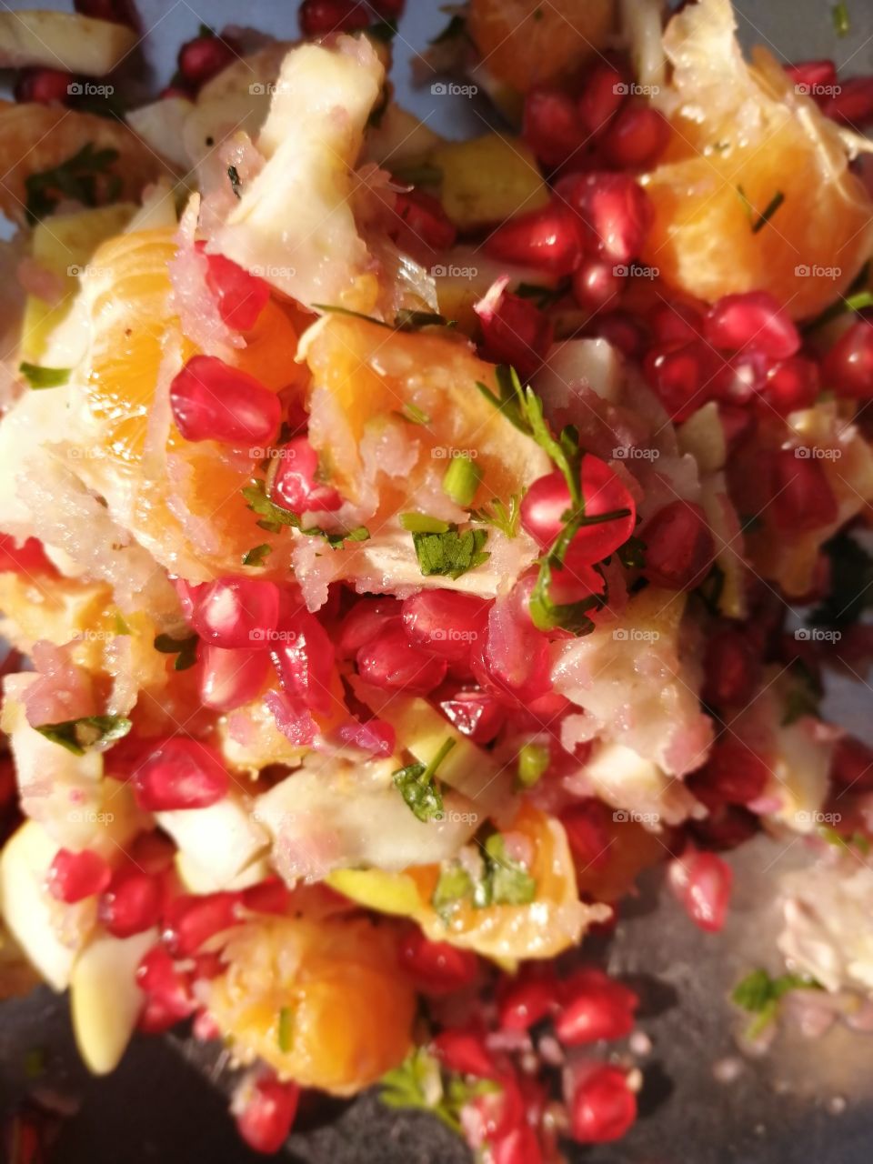 Indian streets healthy food, fruit chaat is called as a fresh fruit salad bowl. It is usually a mix of papaya, banana, pomegranate seed, coriander etc.