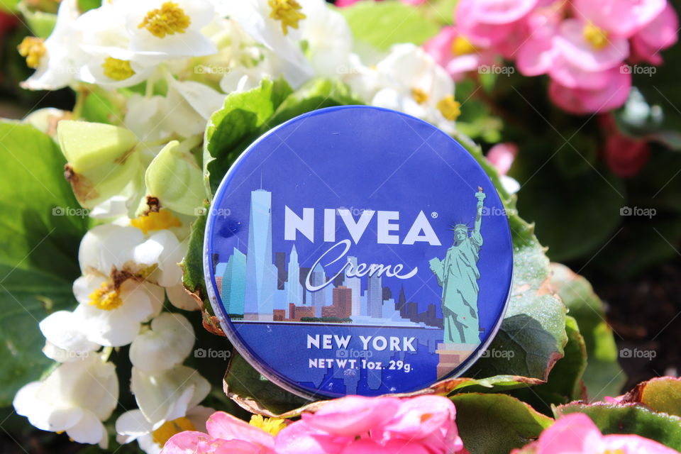 Nivea Creme accented by colorfully soft pink and white flowers