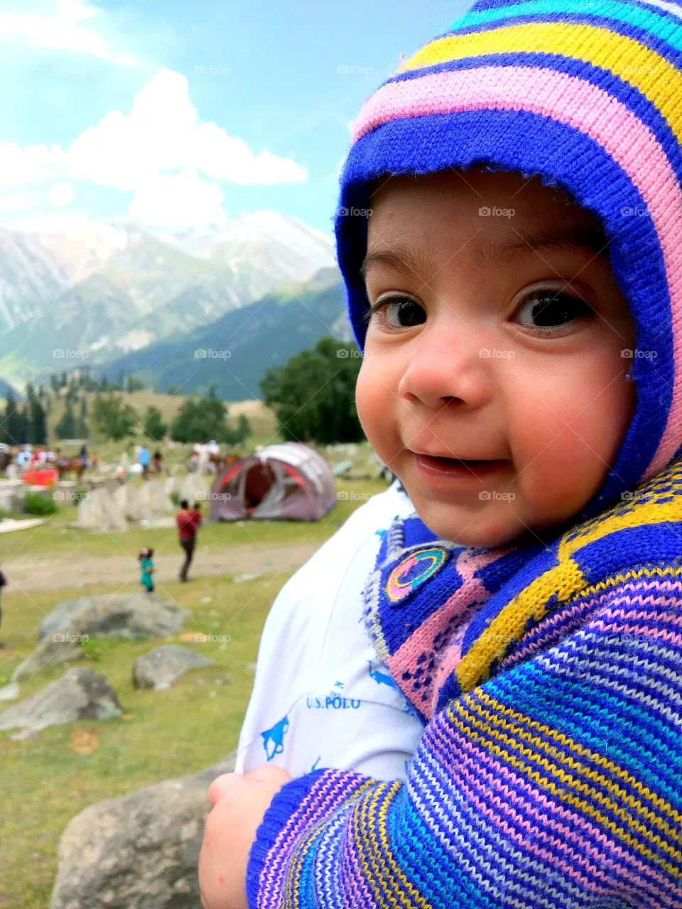 That smile fills your heart with colours ...... refreshing landscape ...... such a beautiful piece ......... kashmir .... cute baby ......... this shows that everything that God has made is just perfect.... just a look at this picture fills you with positive energy and good vibe .... and more the contrasting colours in this picture warms ur heart and gives you a cozy ........ this picture is worth every penny ...... quality wise it's one in a million ...