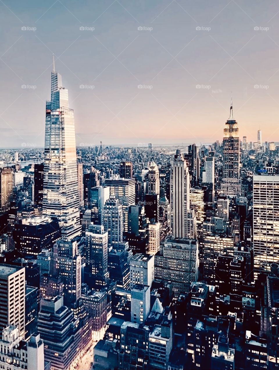 A view from Top of the Rock where you overlook the NYC skyline and look down to see the smaller buildings and streets that make up this magnificent city