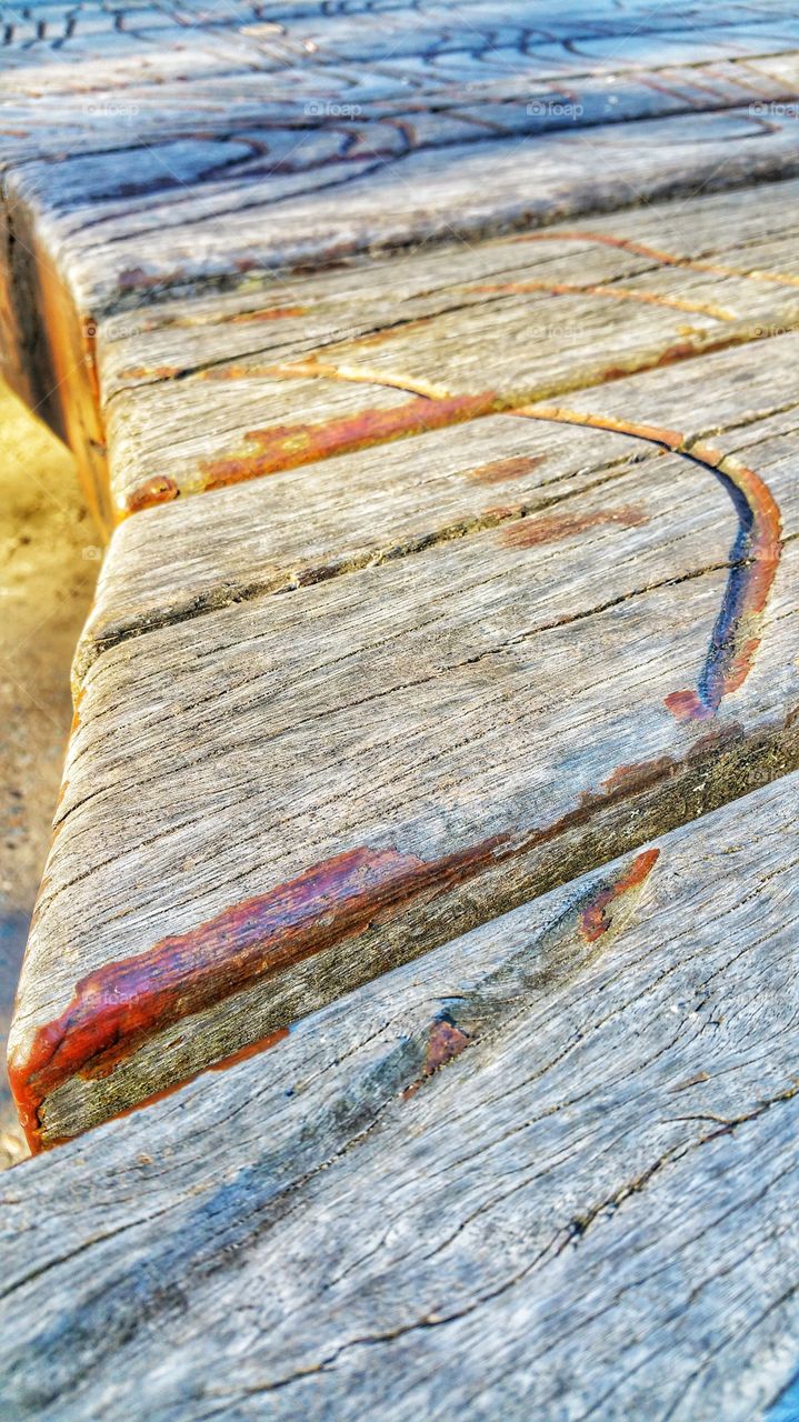 Contrasting texture and patterns on weathered wooden planks.