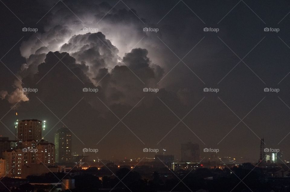 Lightning behind the clouds