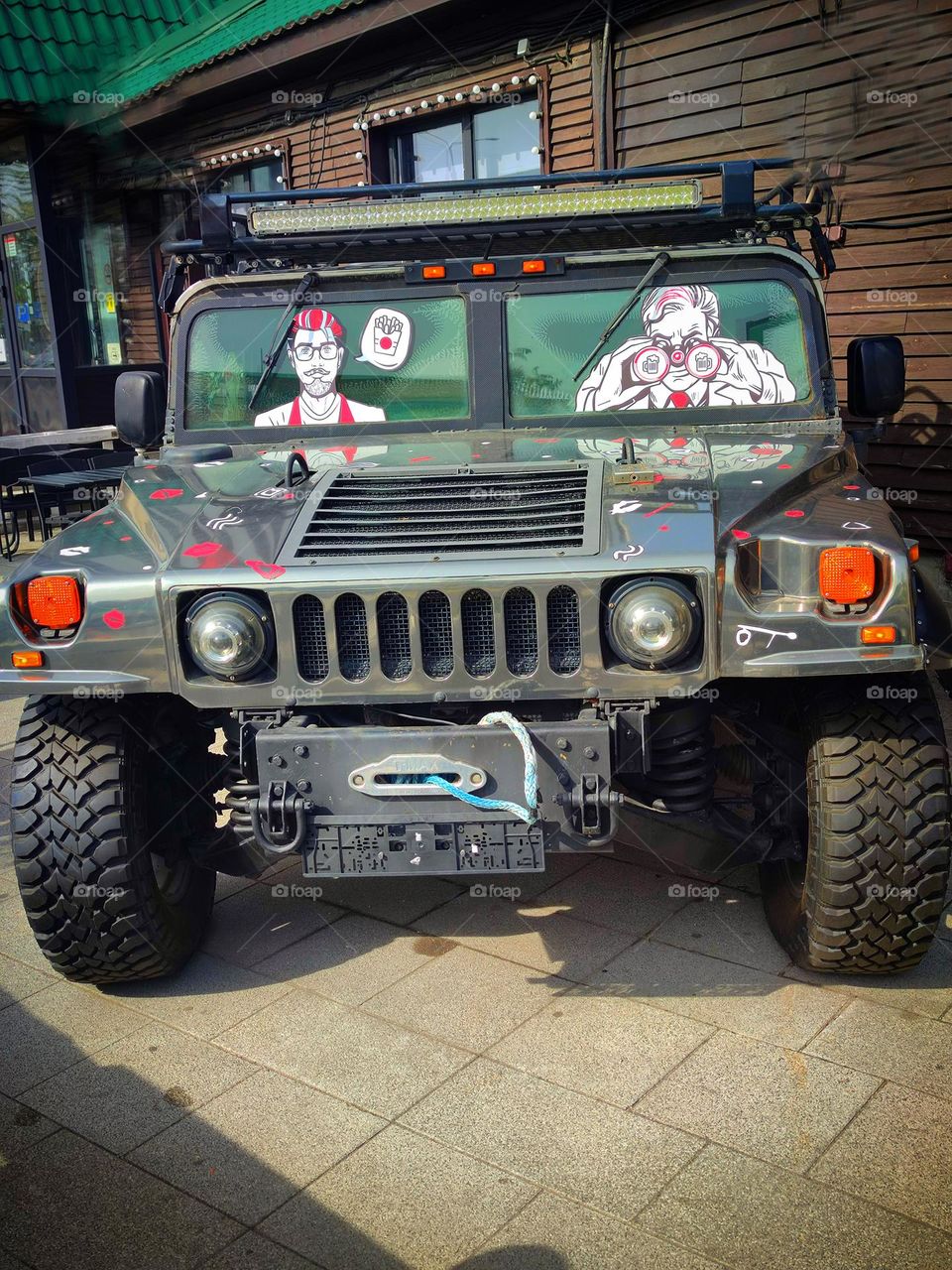 Cars.  The front of the Hummer H1, which stands in the form of decor near the cafe