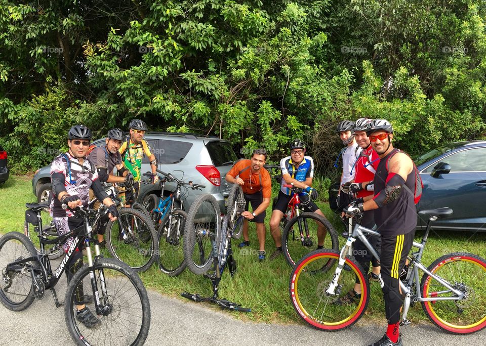 Group of people standing near bicycle