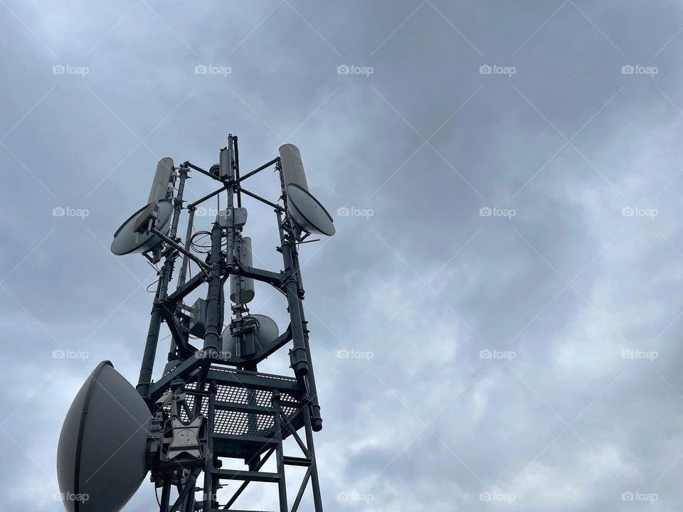 Close up of a transmission tower against dramatic sky