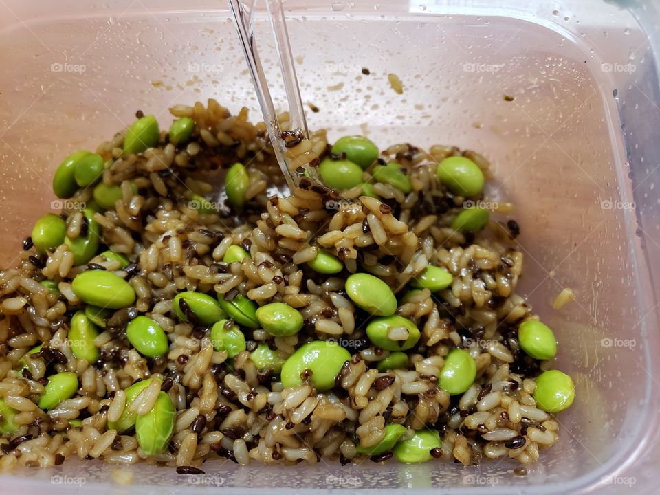 A healthy lunch at work of Edamame and rice with Quinoa and Teriyaki