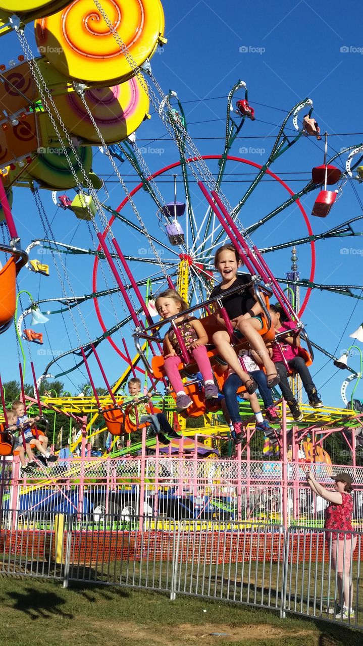 girls at the carnival. Sweet friends have fun