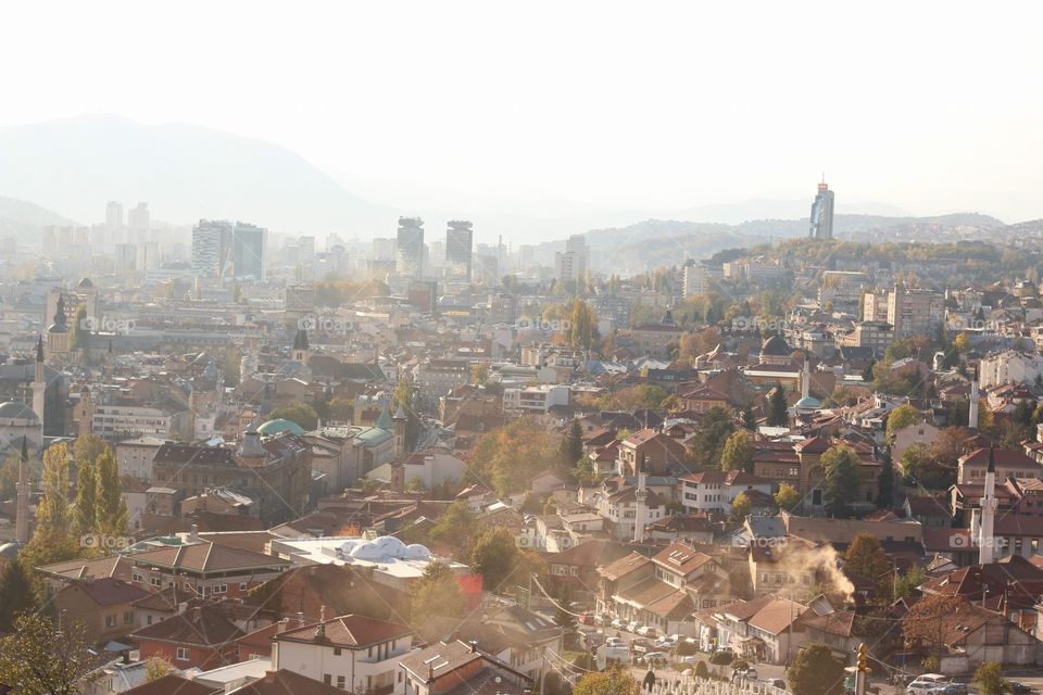 Beautiful city of Sarajevo during the autmn season. Beautiful orange colours and foggy sky