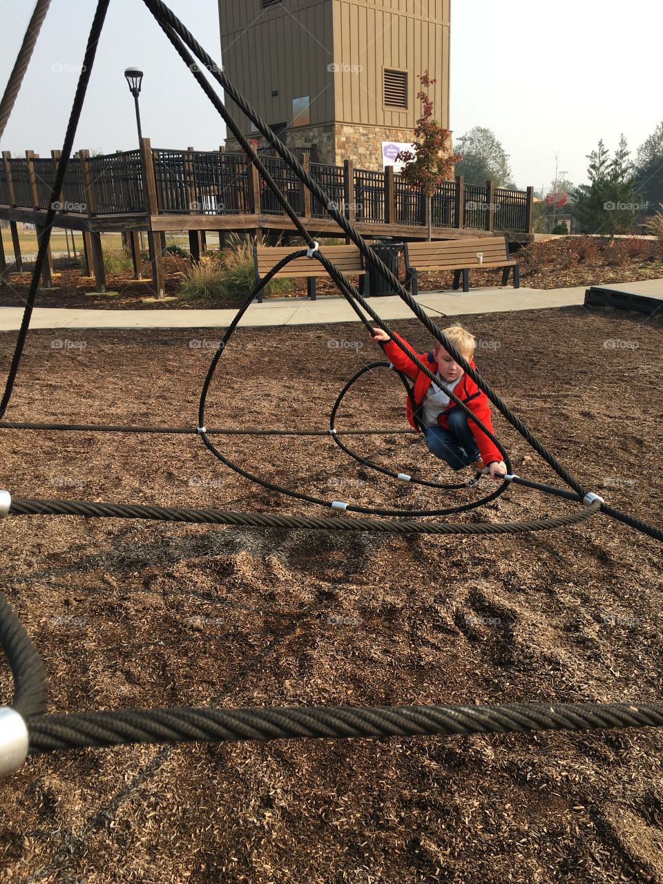 Boy playing alone at park