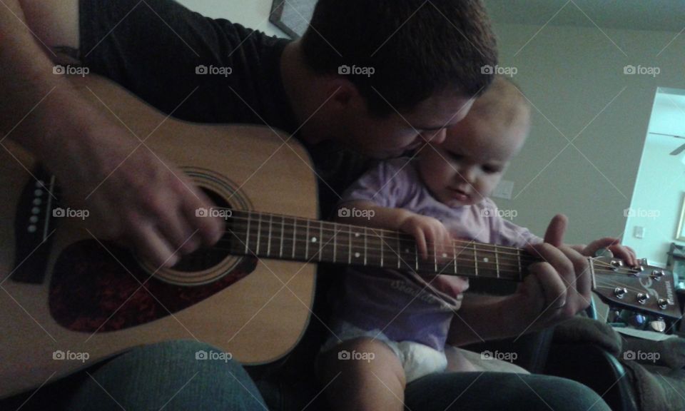 Musical Maiden. Our little girl playing with Daddy!