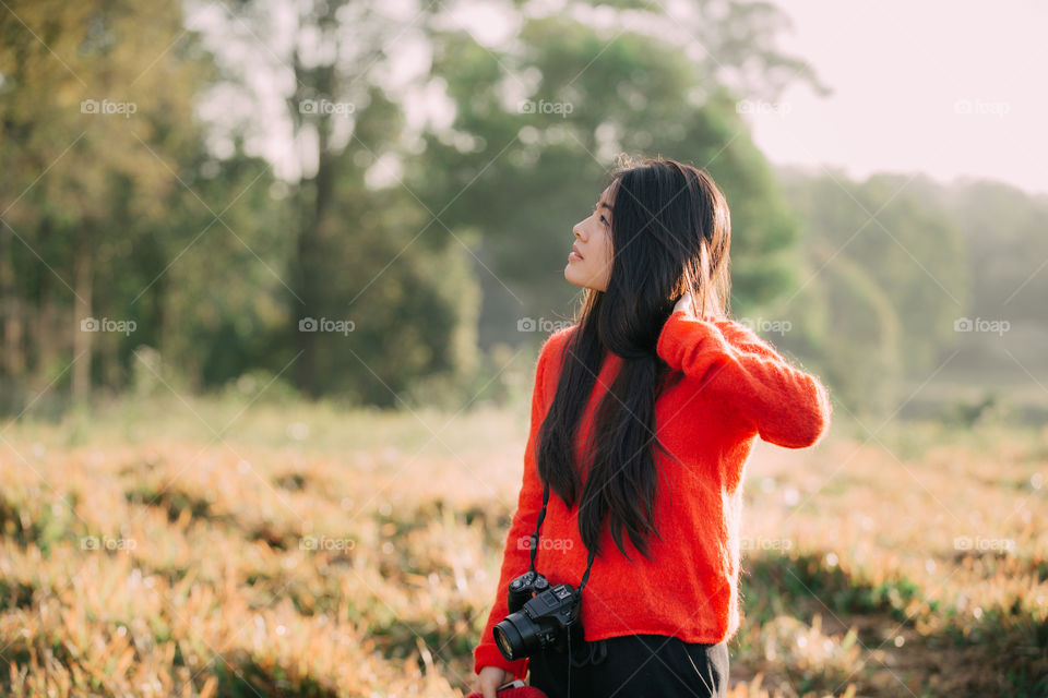 Chinese tourist in the forest field