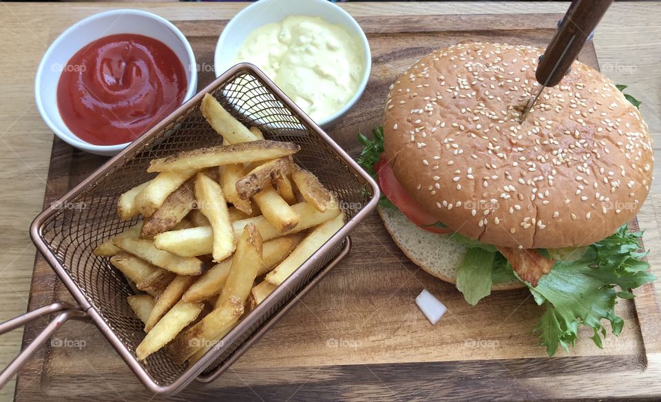 Hamburger with french fries and sauce 