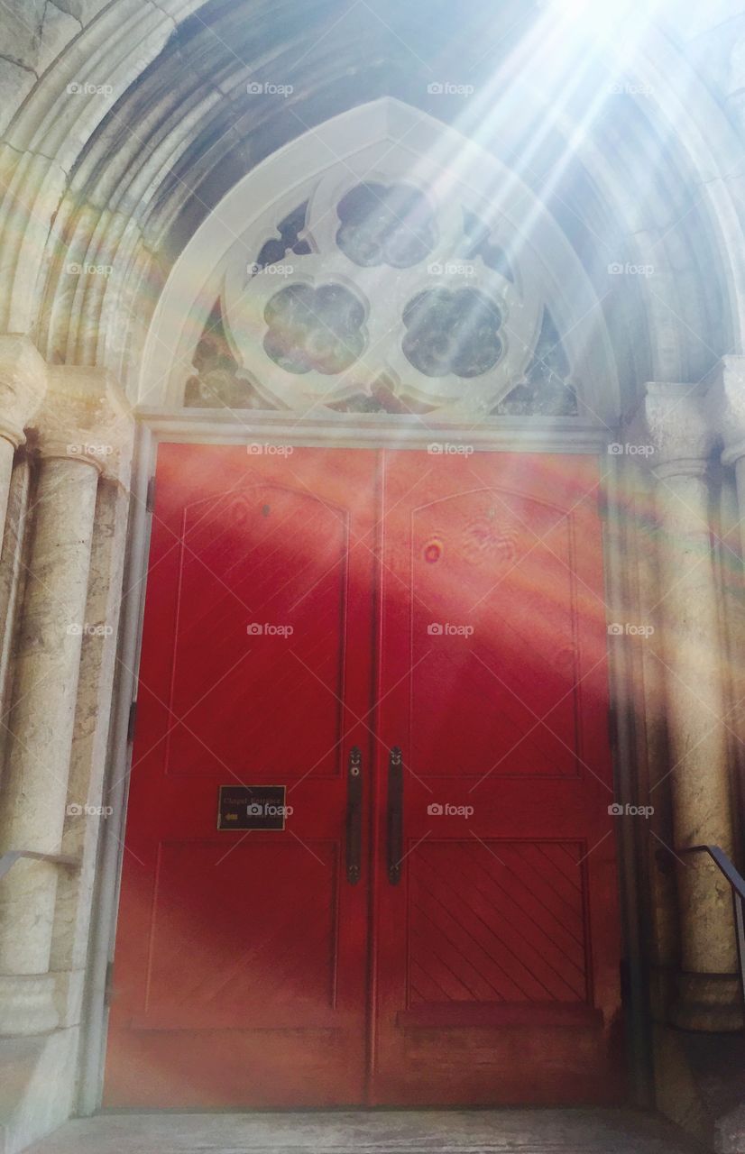 Sun beams on cathedral doors