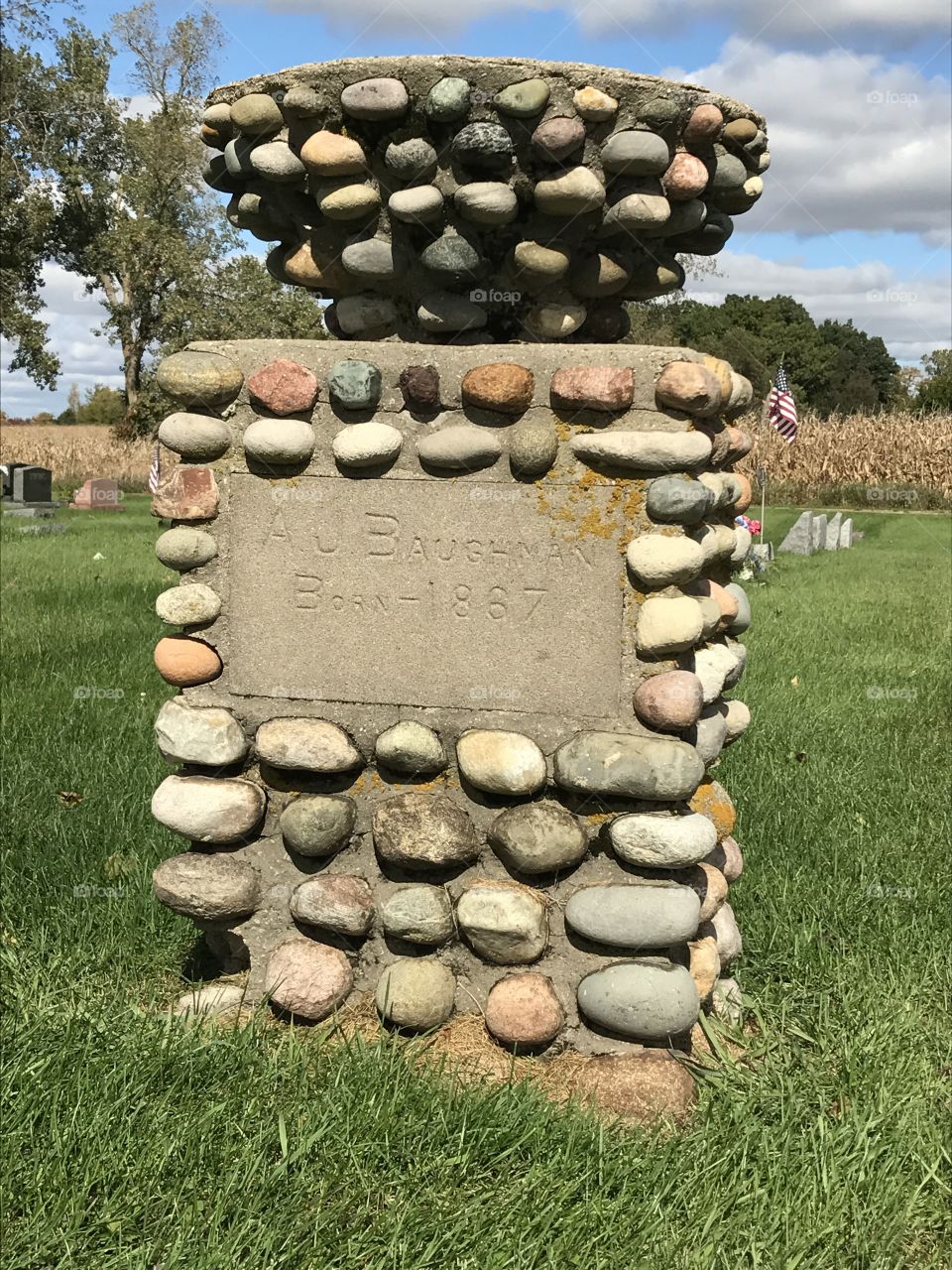 Grave monument at a cemetery without a date of death