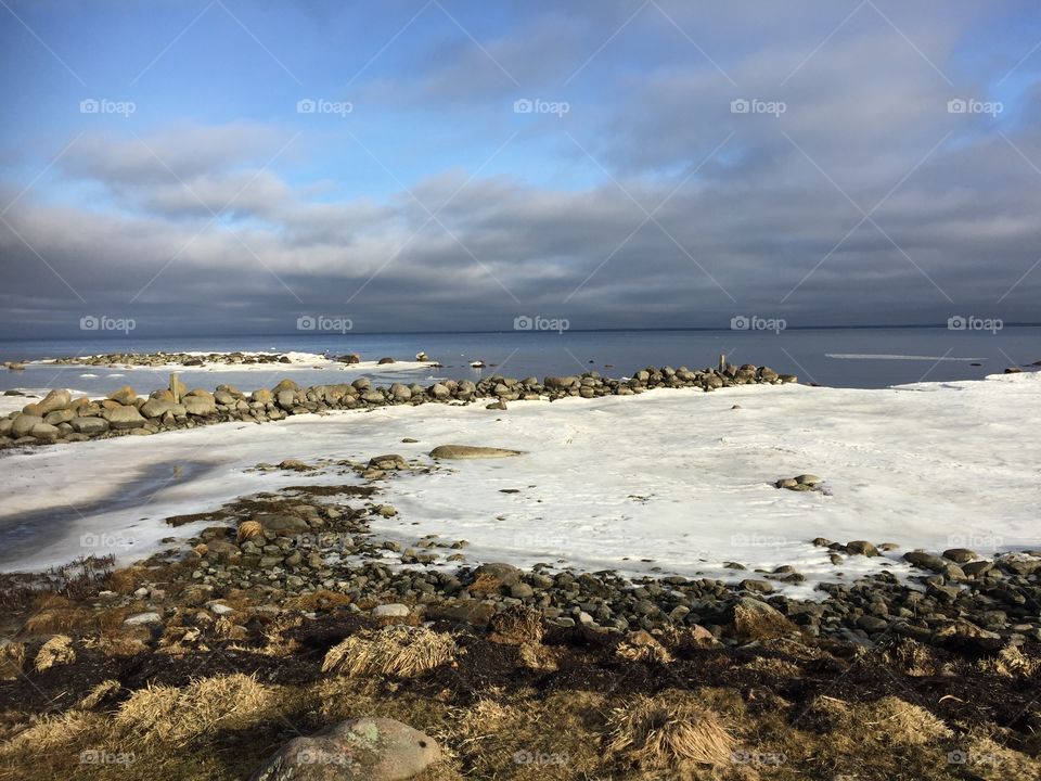 Rocks on beach during winter