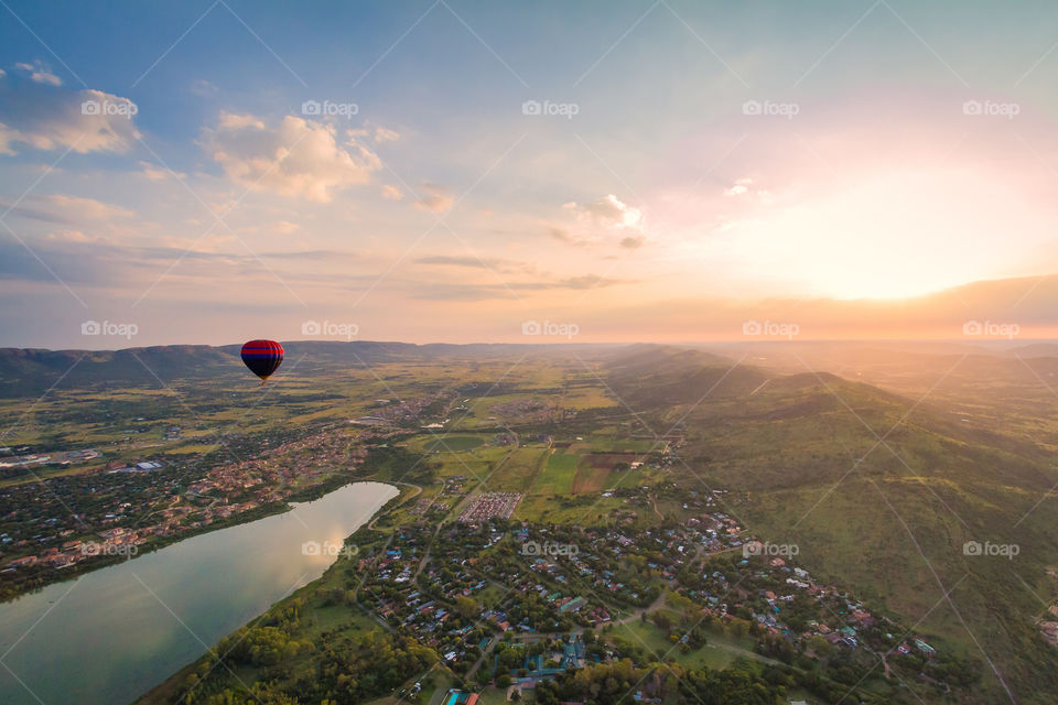 2019 a year of beauty - image of hot air balloon at sunrise with river and town below, South Africa