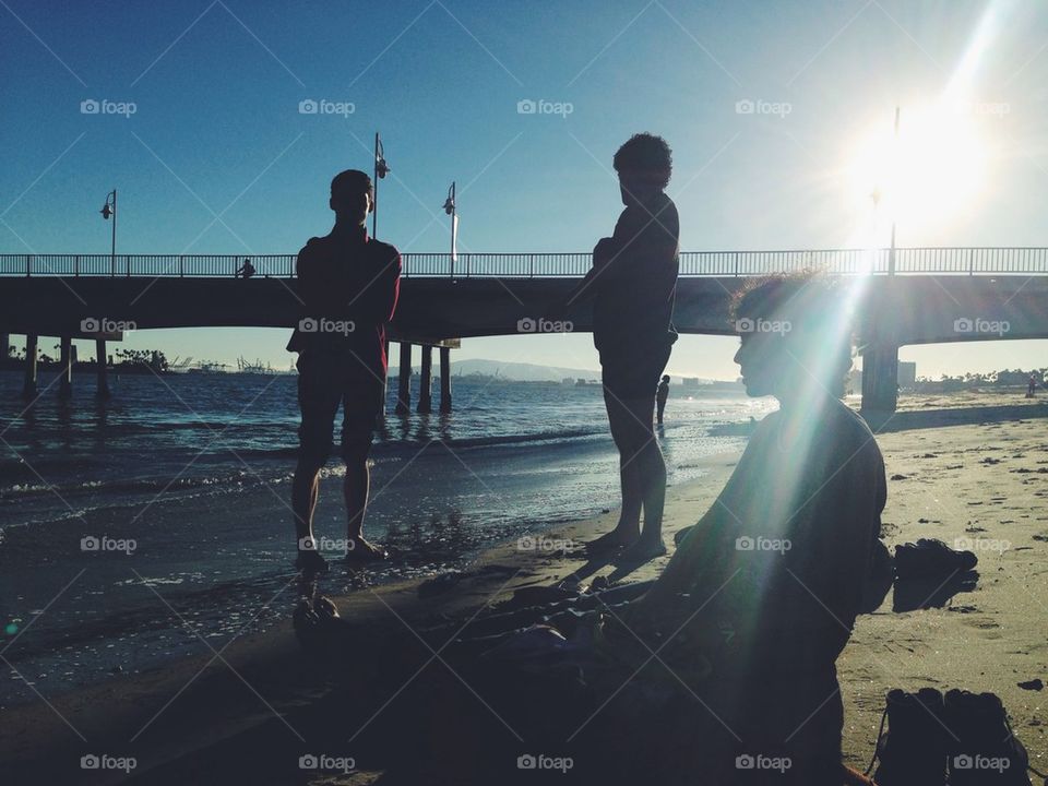 People relaxing on beach