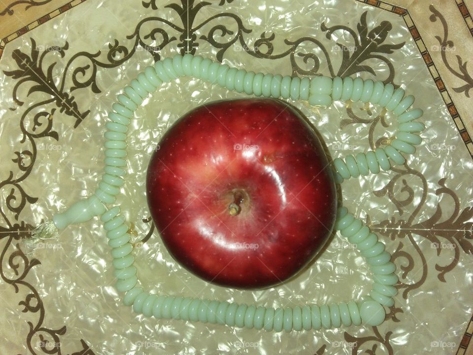 Delicious apple on table