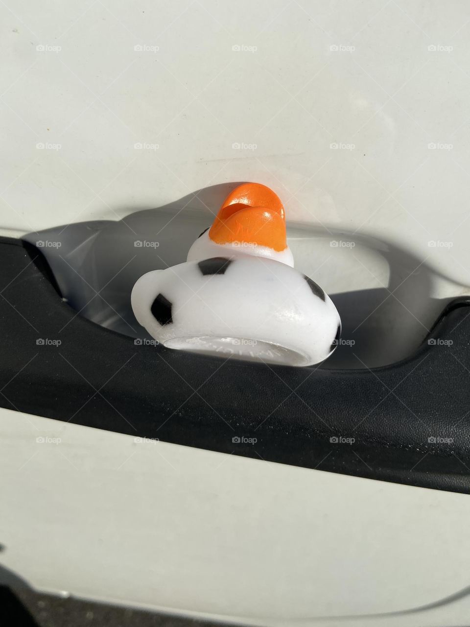 A rubber duck that was placed in the door handle of my Jeep one day when I was out shopping at the mall. Now, it rides with me everywhere, along with another duck that was anonymously gifted to me later as part of a “DuckDuckJeep” movement. So cute! 