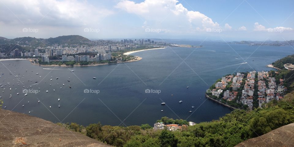 Scenic view of idyllic sea and buildings