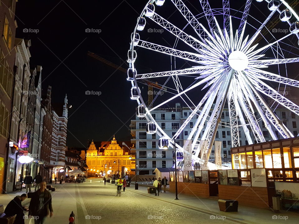 Illuminated AmberSky Wheel in Gdansk at night