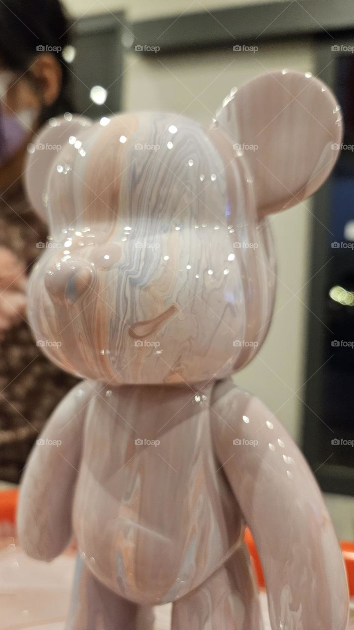 a pouring art toy bear