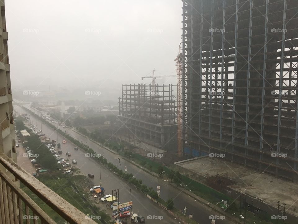 A developing city gets it’s first rainfall of the year - Shot @Noida, India - from my balcony!!