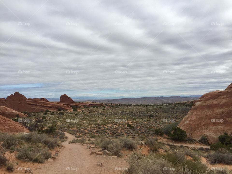 Clouds above desert scenery 