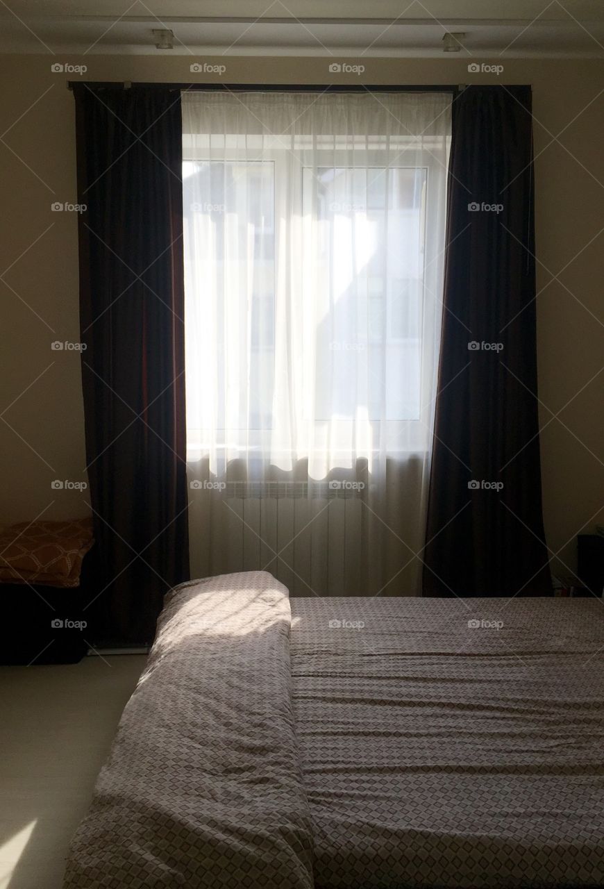 Bedroom with window and sunshine