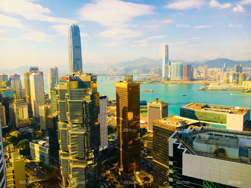 Hong Kong harbor. Historical. Above the world and intangible. Expansive city line that is indescribable from pictures alone. A magnitude that can only be felt in person. 