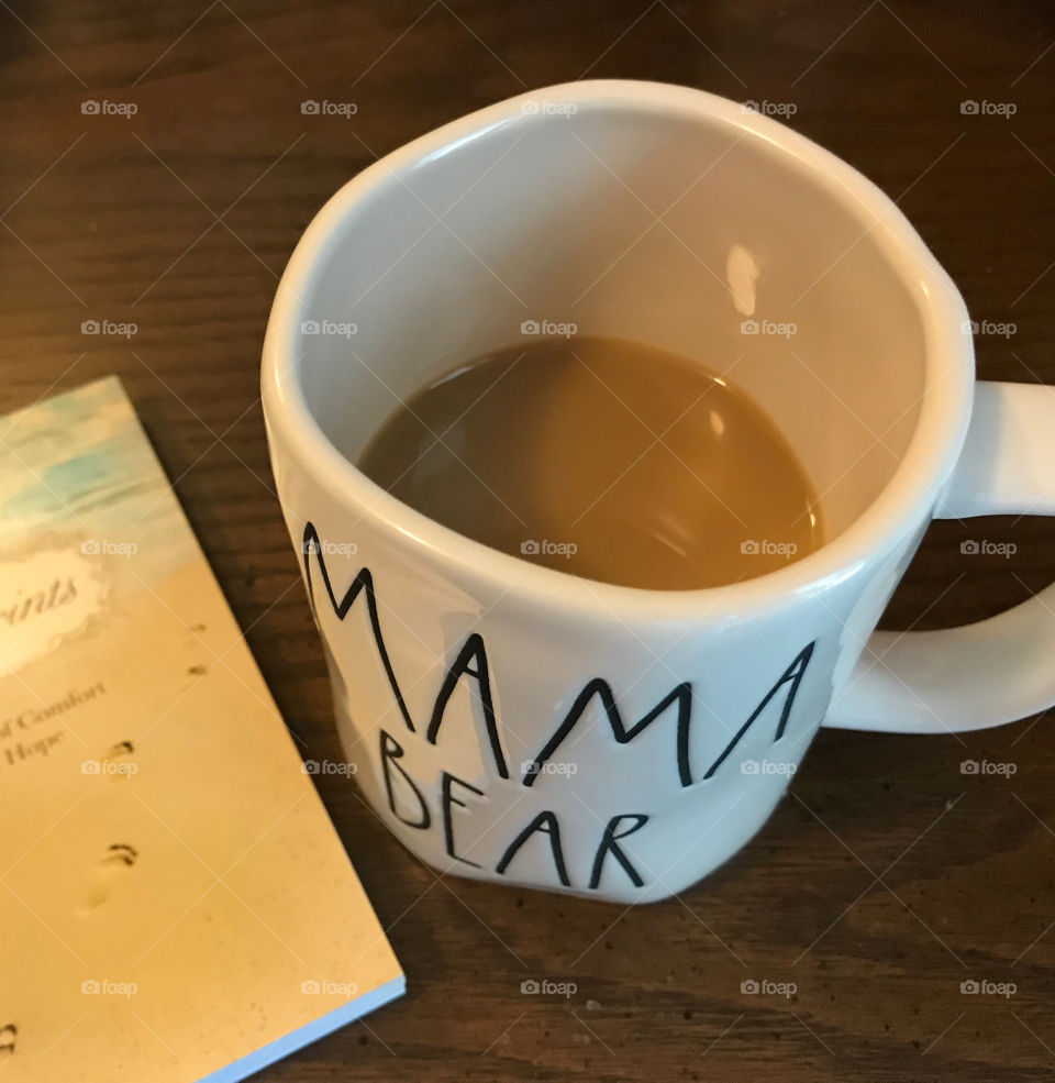 Cup of coffee with a book