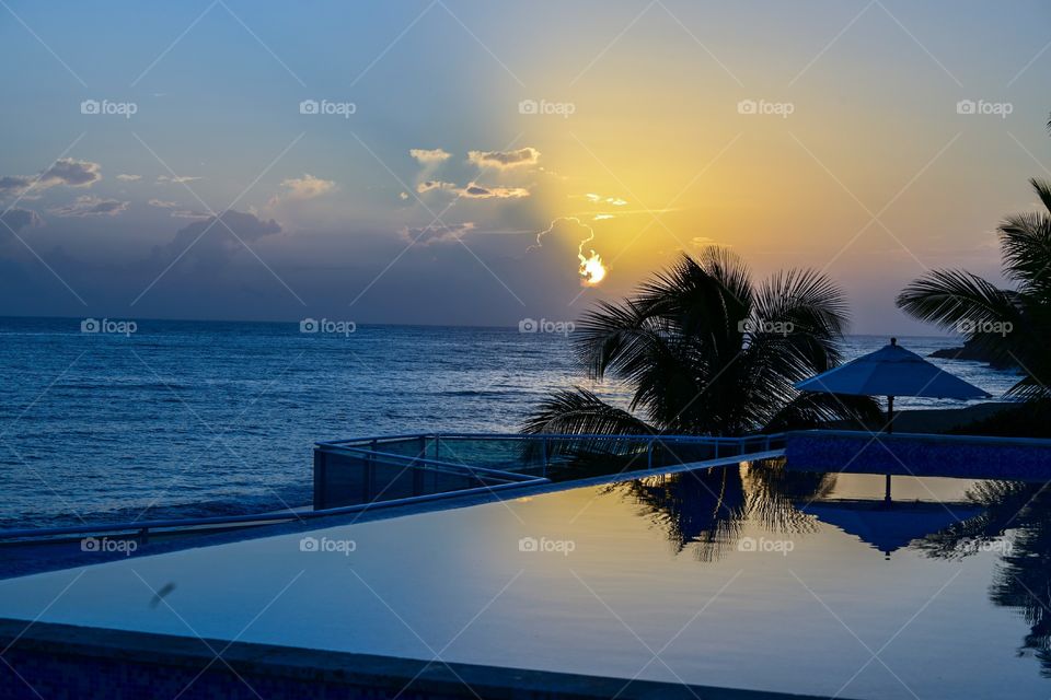 blue sky orange sunrise on Laguna beach Sosua Dominican Republic