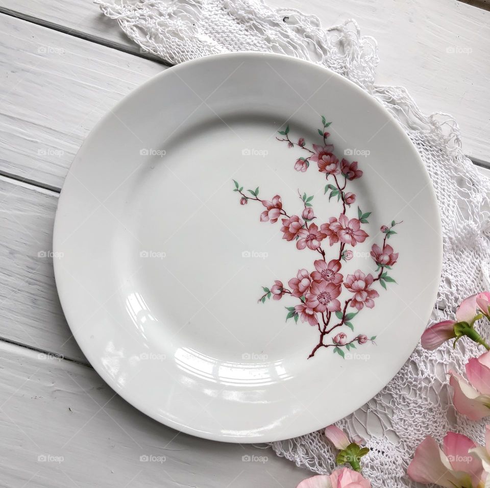 Old chinaware plate with flowers ornament