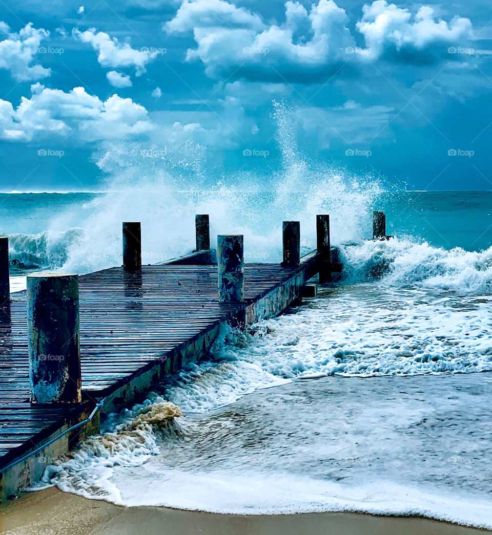 Waves splashing on pier