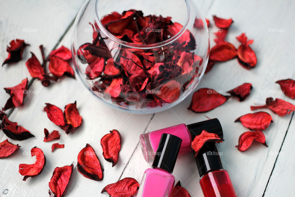 Beauty, health, spa and personal care: nail polish, flowers, rose petals