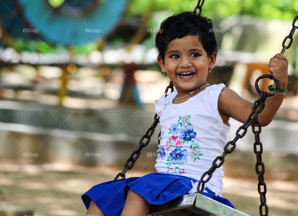 Girl enjoying swing