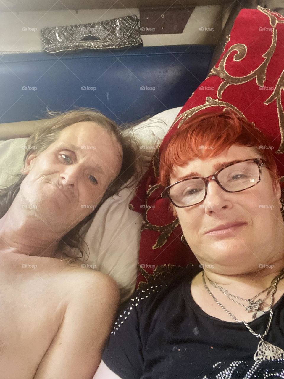 This is me, „Petra Schiller“ a.k.a. „Maxine Firefox“ aboard „Salvation“, our „1969 Luhrs“ cabin cruiser at „Newtown Creek“ in LIC, Queens with partner „Timothy Trespas“. reclining on our bed with rich gold lamé decor. 2023. Hypnotic Productions