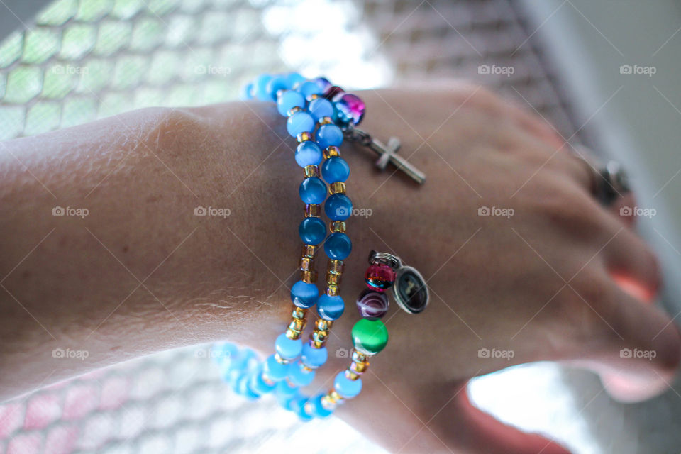 Handmade wrap rosery bracelet with beautiful perfectly round blue beads and a few pinks with purple.