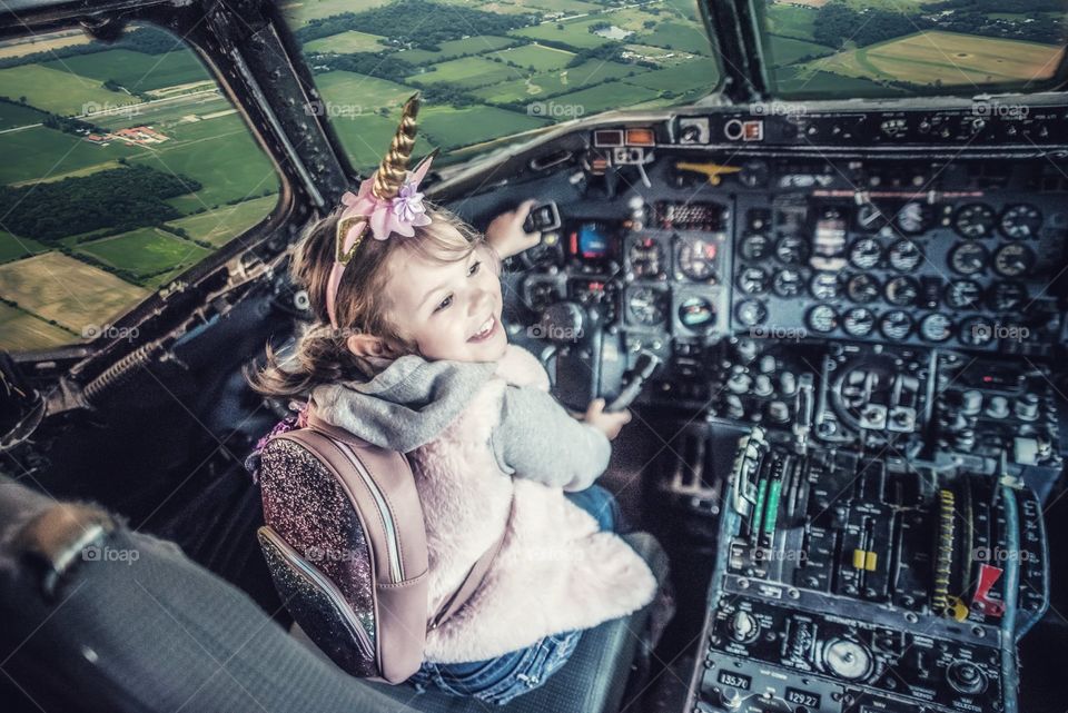 Girl in a cockpit of a plane 