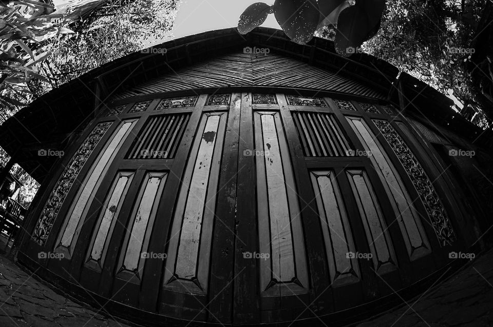 image of a joglo house (traditional javanese house) on fish eye lens