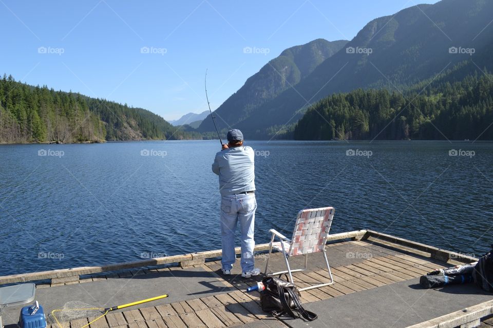 Morning fresh water fishing. Fishing off the dock on the lake