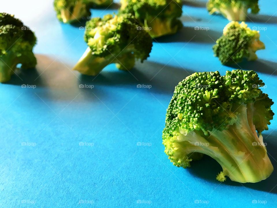 Broccoli  on blue background 