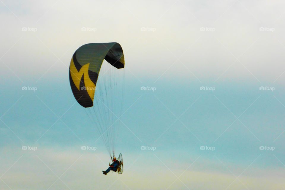 Free in the sky. A man is flying free in the sky in front of my terrace