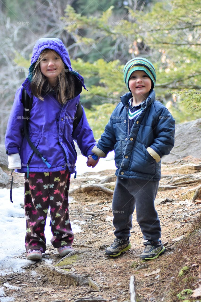 siblings holding hands