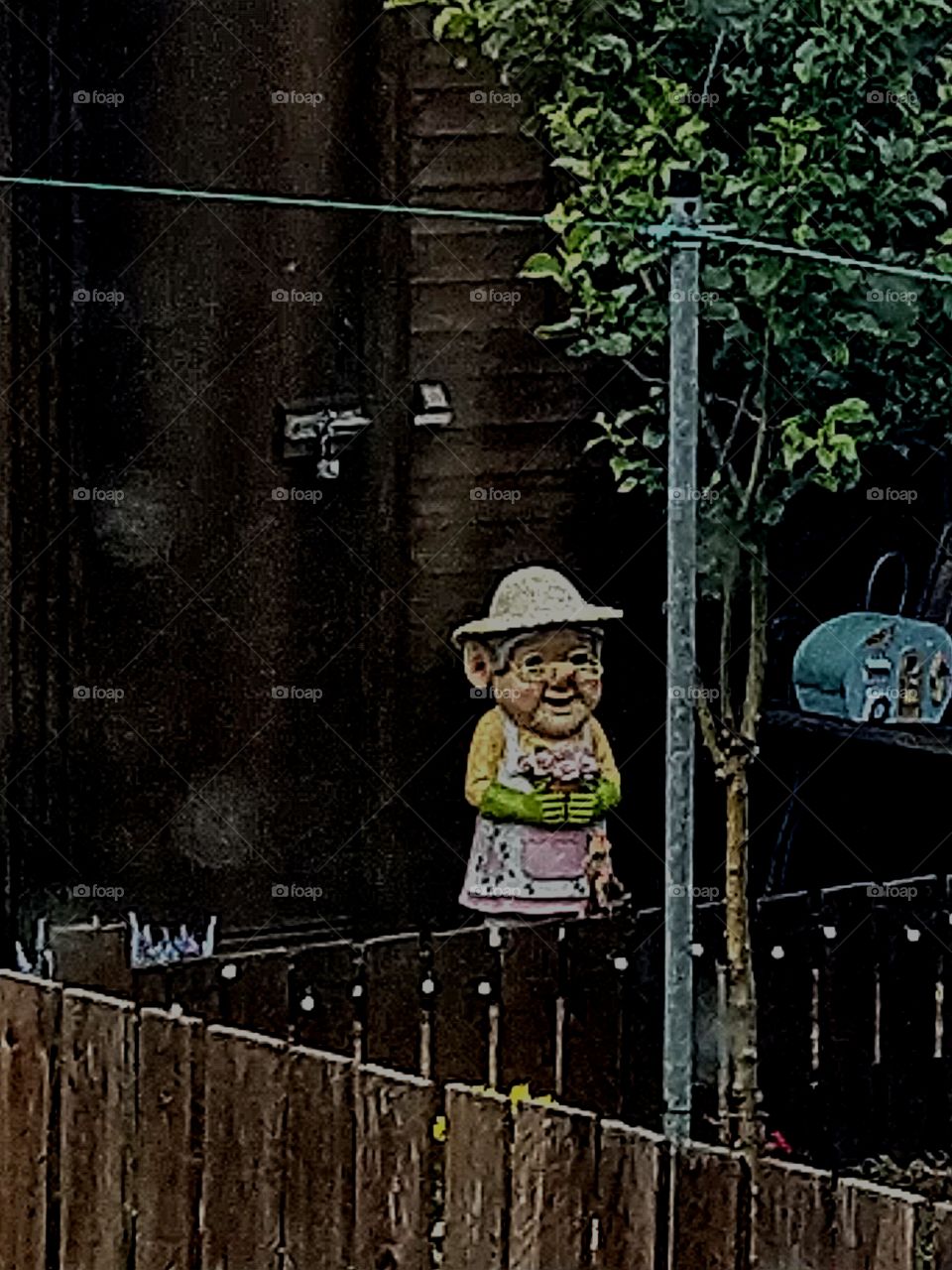 creepy as gnome in my neighbours backyard horribly zoomed in