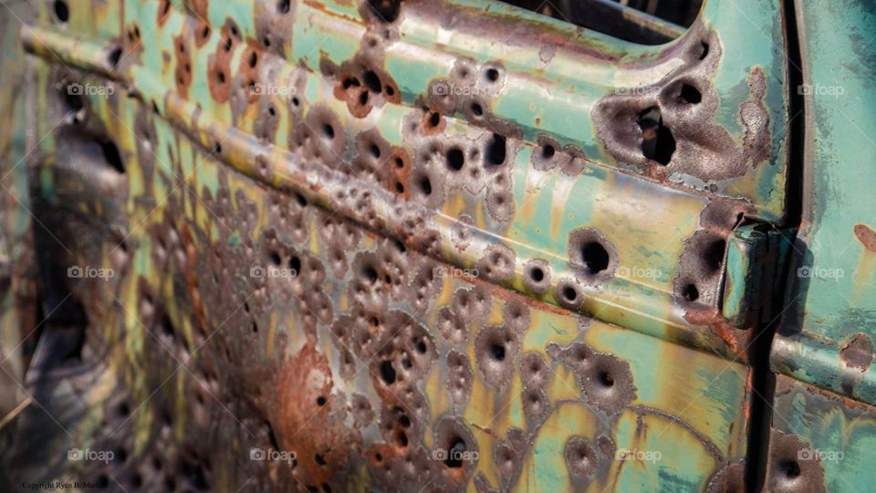 Bullet ridden old car