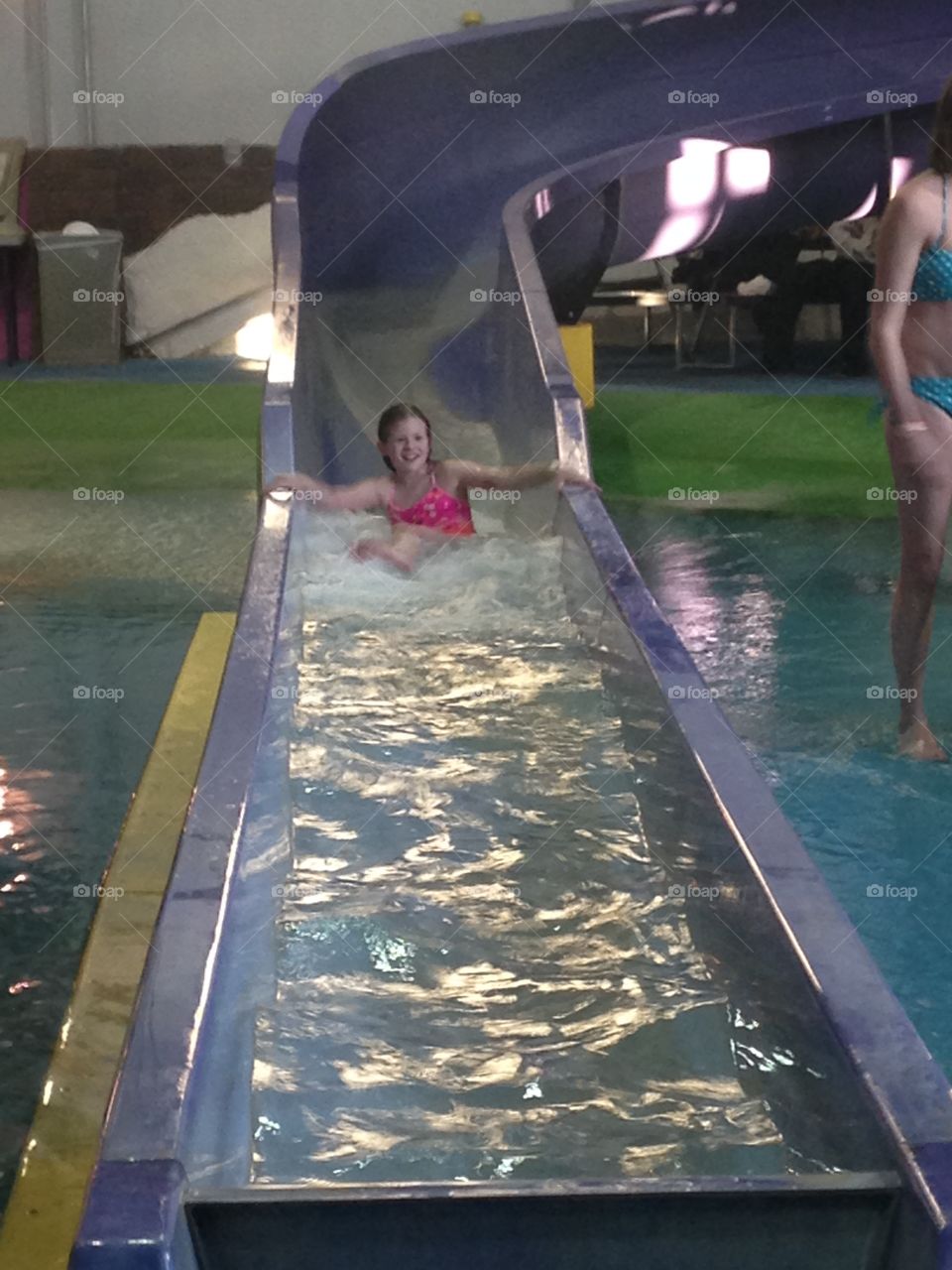 Water park. Niece sliding down a water slide in Dubuque