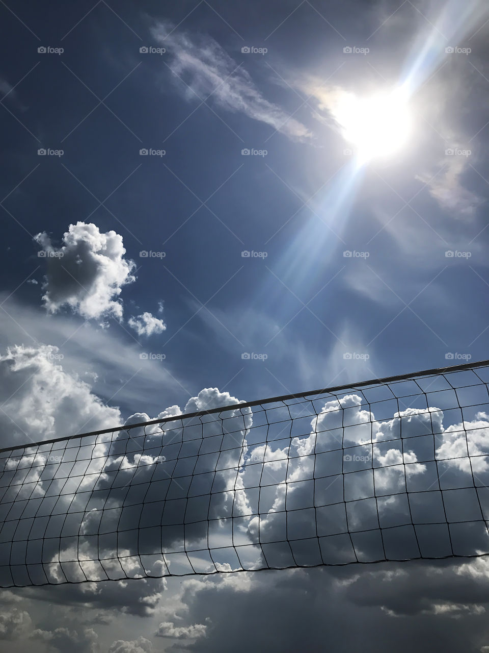 Enjoying summer vacation with beach volleyball 