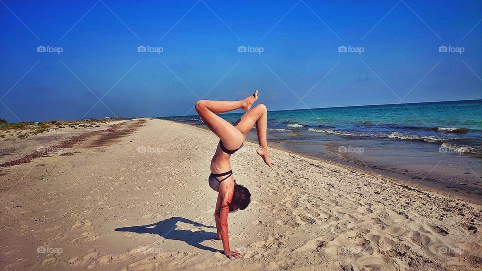 Sports morning on the beach by the sea. Beautiful and enchanting sea.